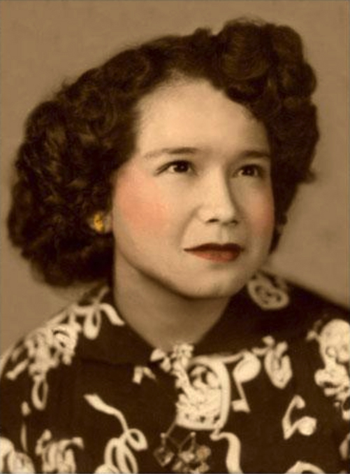 The same portrait after manual digital restoration, with damage reconstructed and tones rebuilt