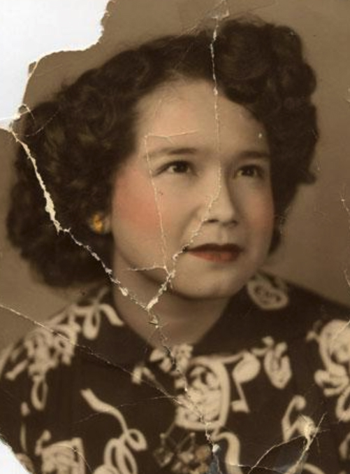 Original damaged vintage portrait photograph with tears, creases and missing areas